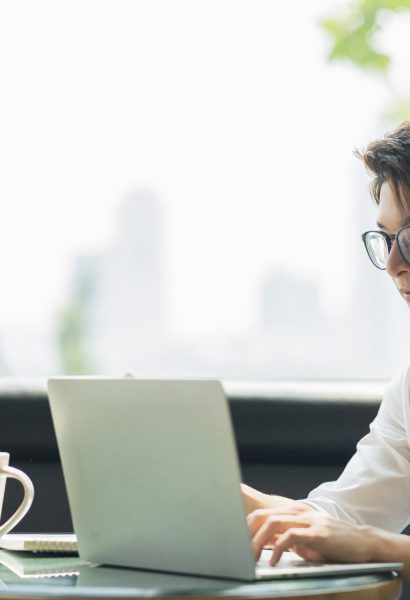 Smart attractive positive asian business male wearing glasses work remote new normal lifestyle hand use laptop tele conference onlive videocall meeting remote business ideas concept