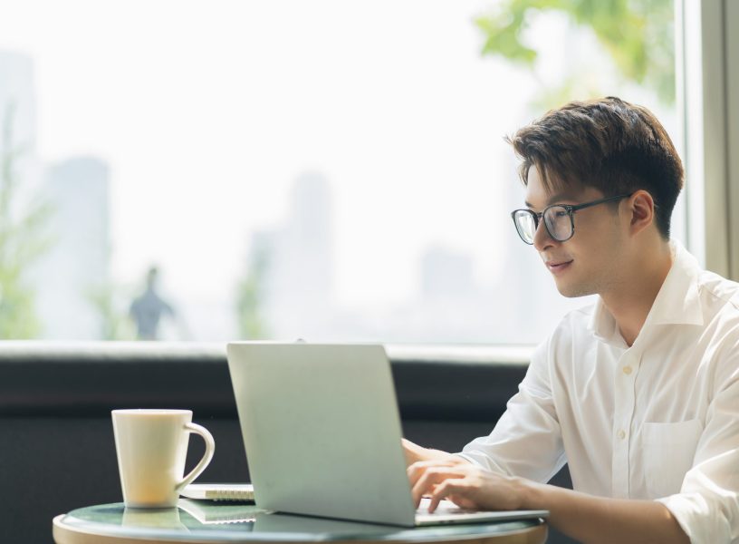 Smart attractive positive asian business male wearing glasses work remote new normal lifestyle hand use laptop tele conference onlive videocall meeting remote business ideas concept